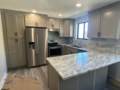 13-Nov 11 2024 08_08pm-nfsi Modern kitchen featuring gray cabinetry, stainless steel appliances, and a polished granite countertop, highlighting a functional and stylish design for remodeling projects.